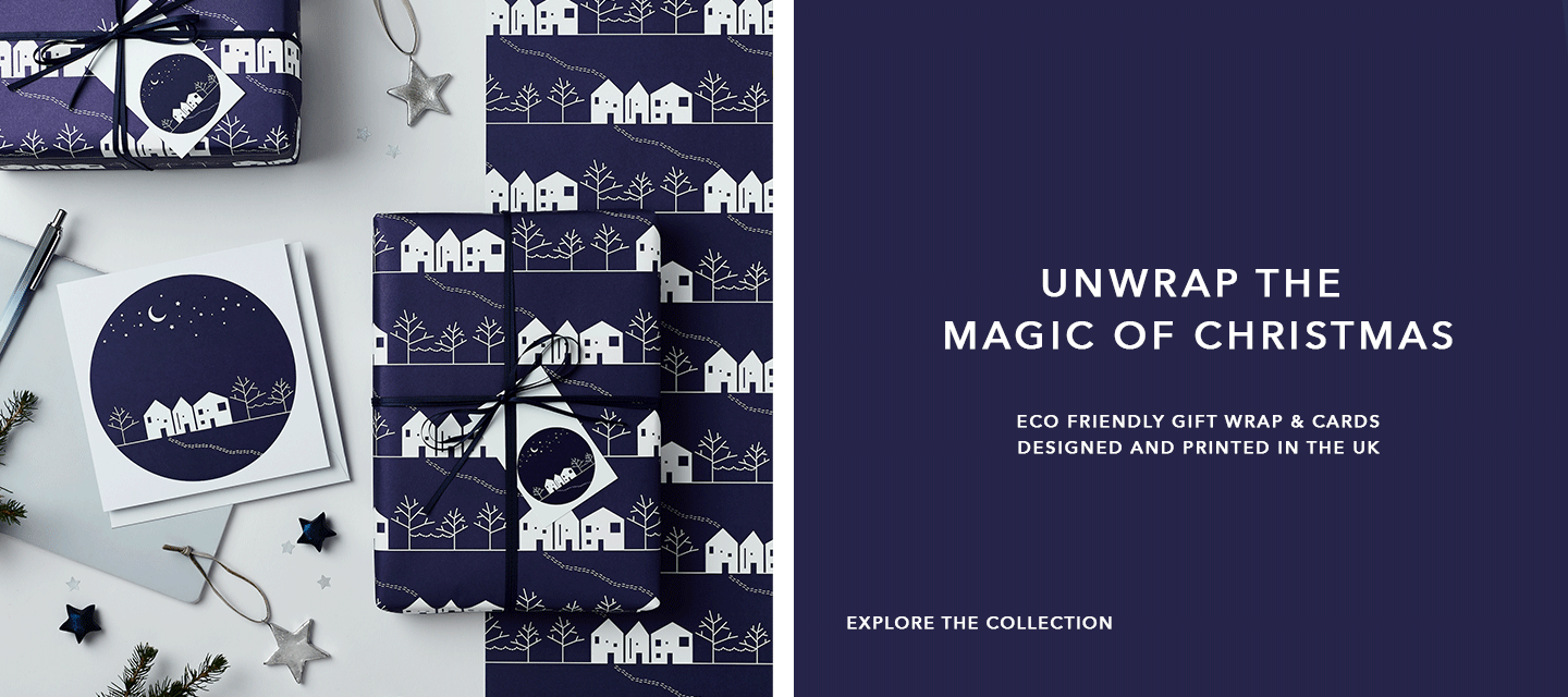 Navy blue and white eco friendly Christmas wrapping paper printed with a winter scene